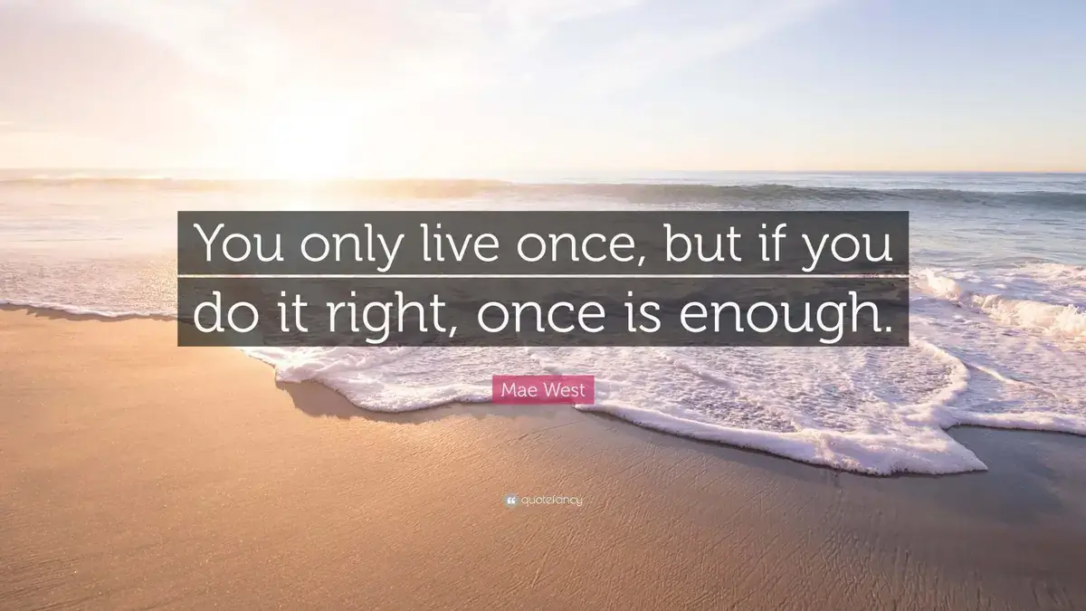 Quotefancy digital from Reach Media Network signage displaying inspirational quote from Mae West and beach imagery.