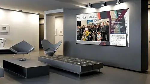 digital signage screen from Reach Media Network at Vista Capital Partners corporate office lobby