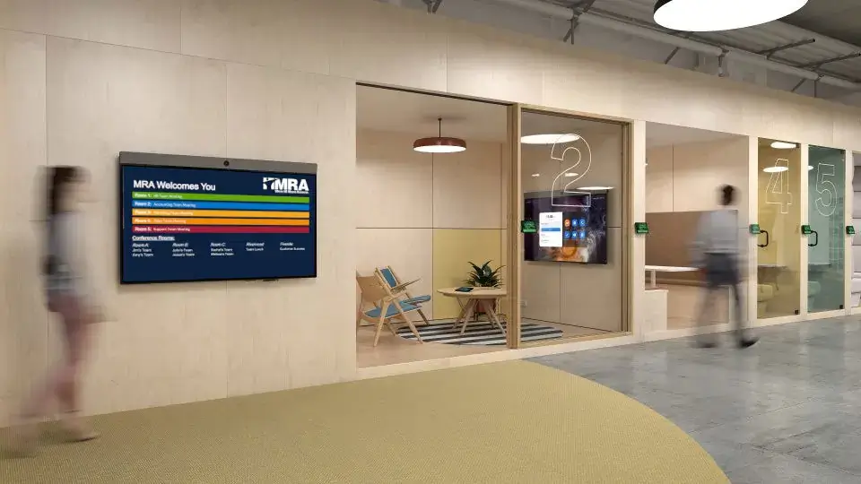 Reach-Media-Network-meeting-room-digital-signage-MRA-office Corporate digital signage from Reach Media Network displaying various room schedules for MRA office.