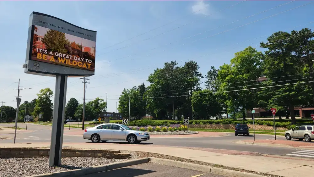 Reach-Media-Network-outdoor-digital-signage-Northern-Michigan-University Northern Michigan University outdoor digital signage from Reach Media Network featured at property entrance