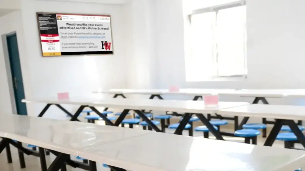 Reach Media Network Schools K12 digital signage High school digital signage by Reach Media Network featured in student cafeteria.