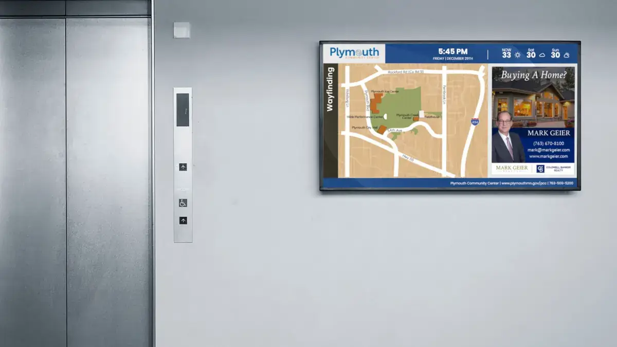 Plymouth Community Center digital signage from Reach Media Network featured by an elevator and displaying local map and advertisements.